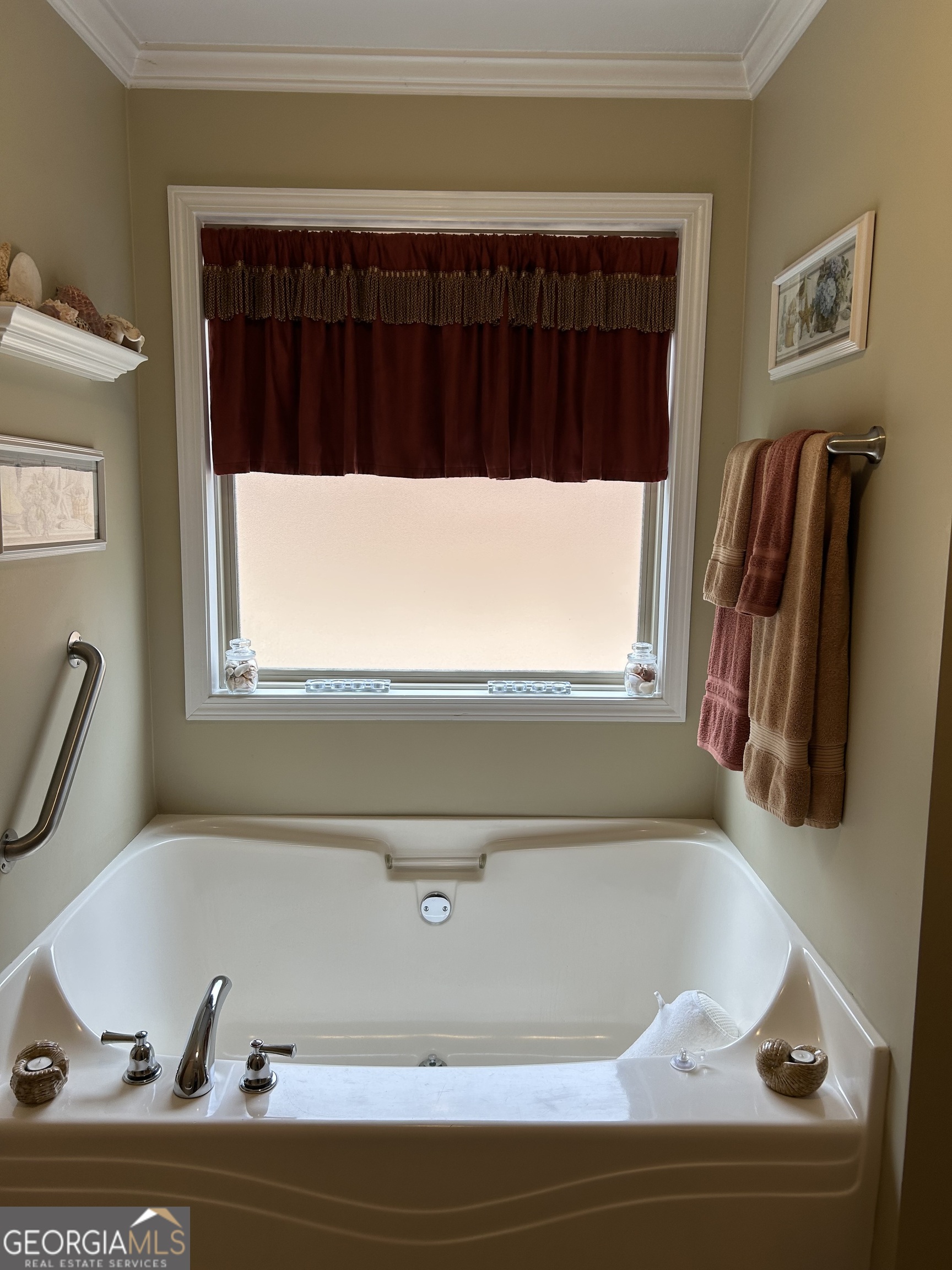950 John Lovelace Road LaGrange, GA 30241 - Photo 27 of 47 a bathroom with a bathtub and a window