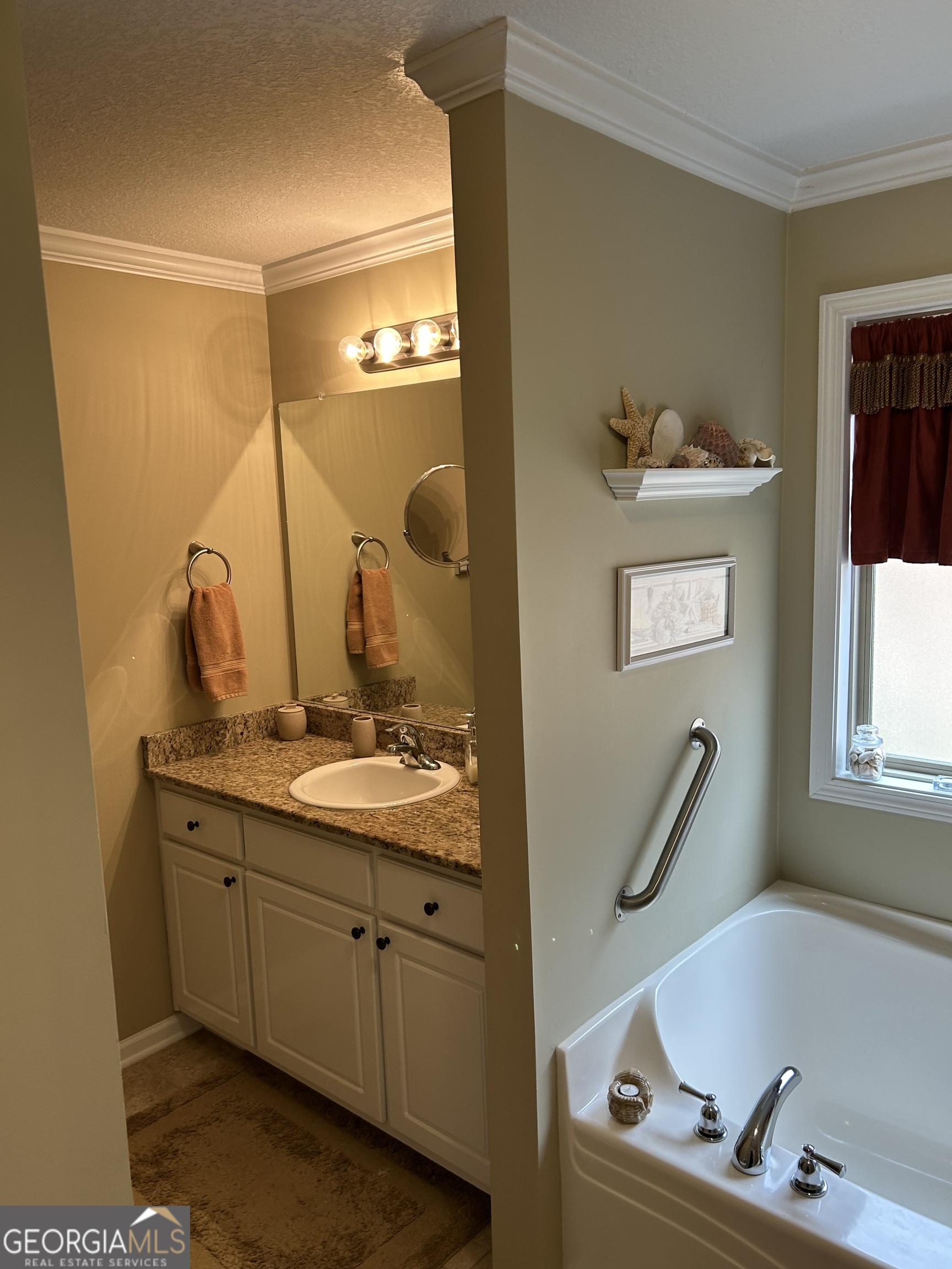 950 John Lovelace Road LaGrange, GA 30241 - Photo 29 of 47 a bathroom with a tub sink and mirror
