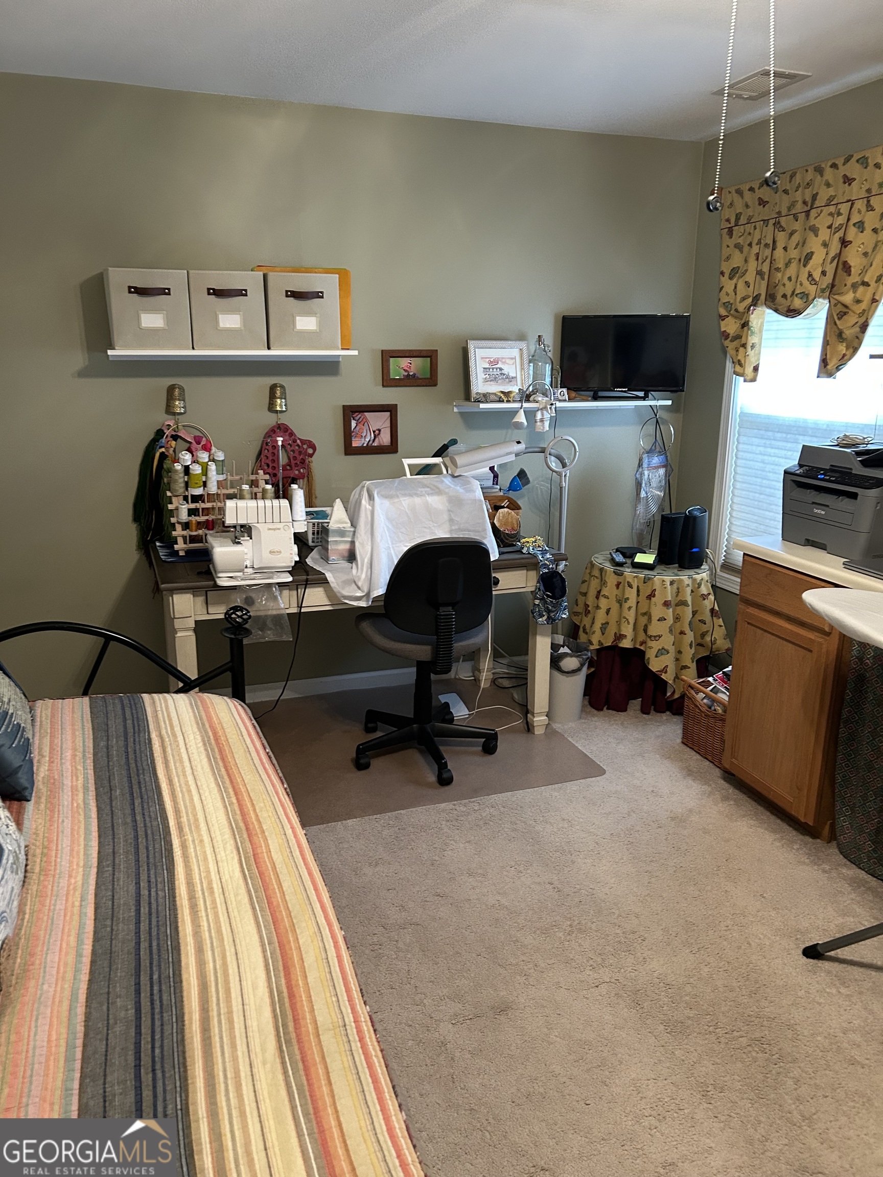 950 John Lovelace Road LaGrange, GA 30241 - Photo 35 of 47 a view of a workspace with a window beside a bedroom