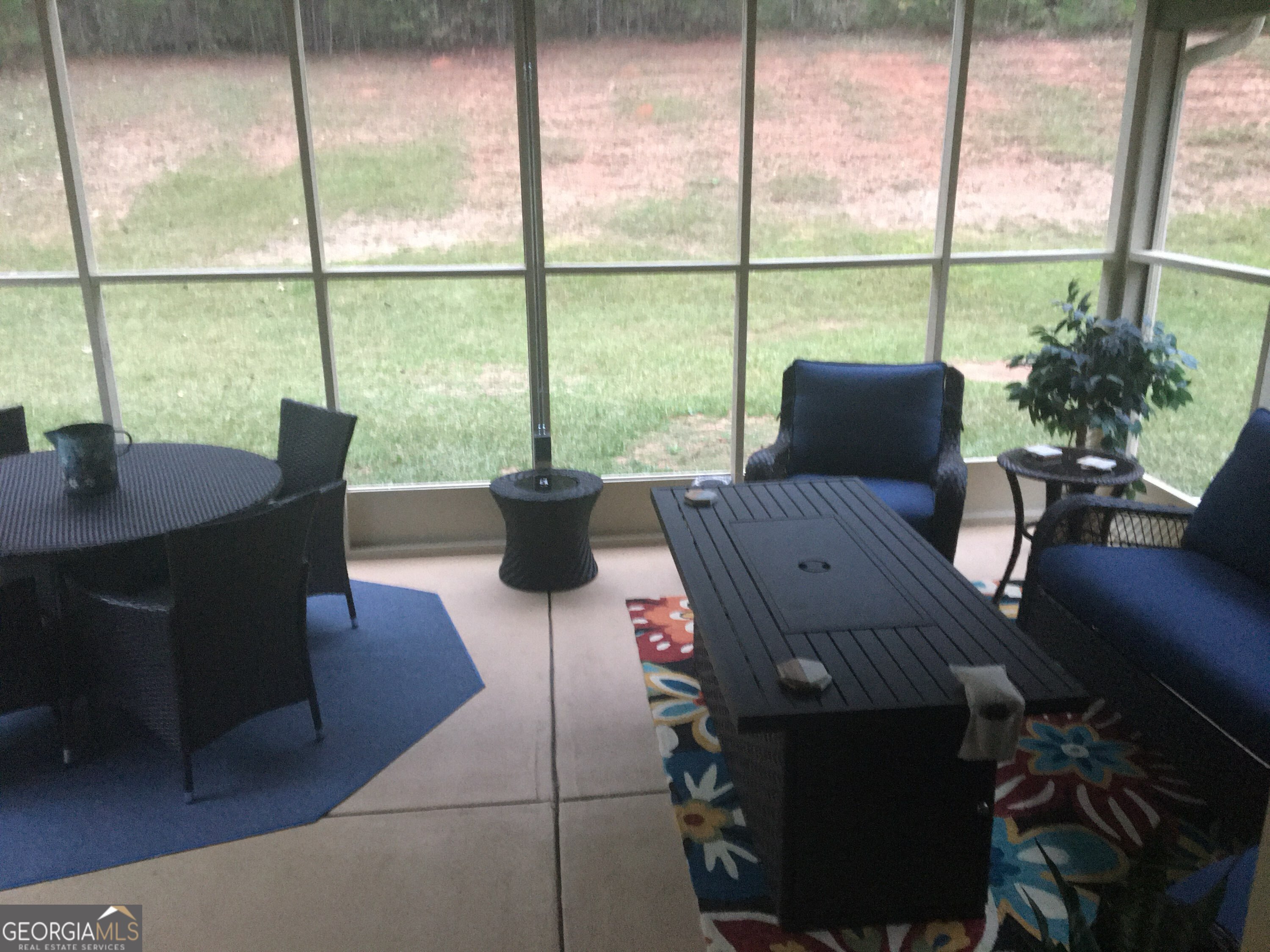 950 John Lovelace Road LaGrange, GA 30241 - Photo 44 of 47 a living room with furniture and a floor to ceiling window