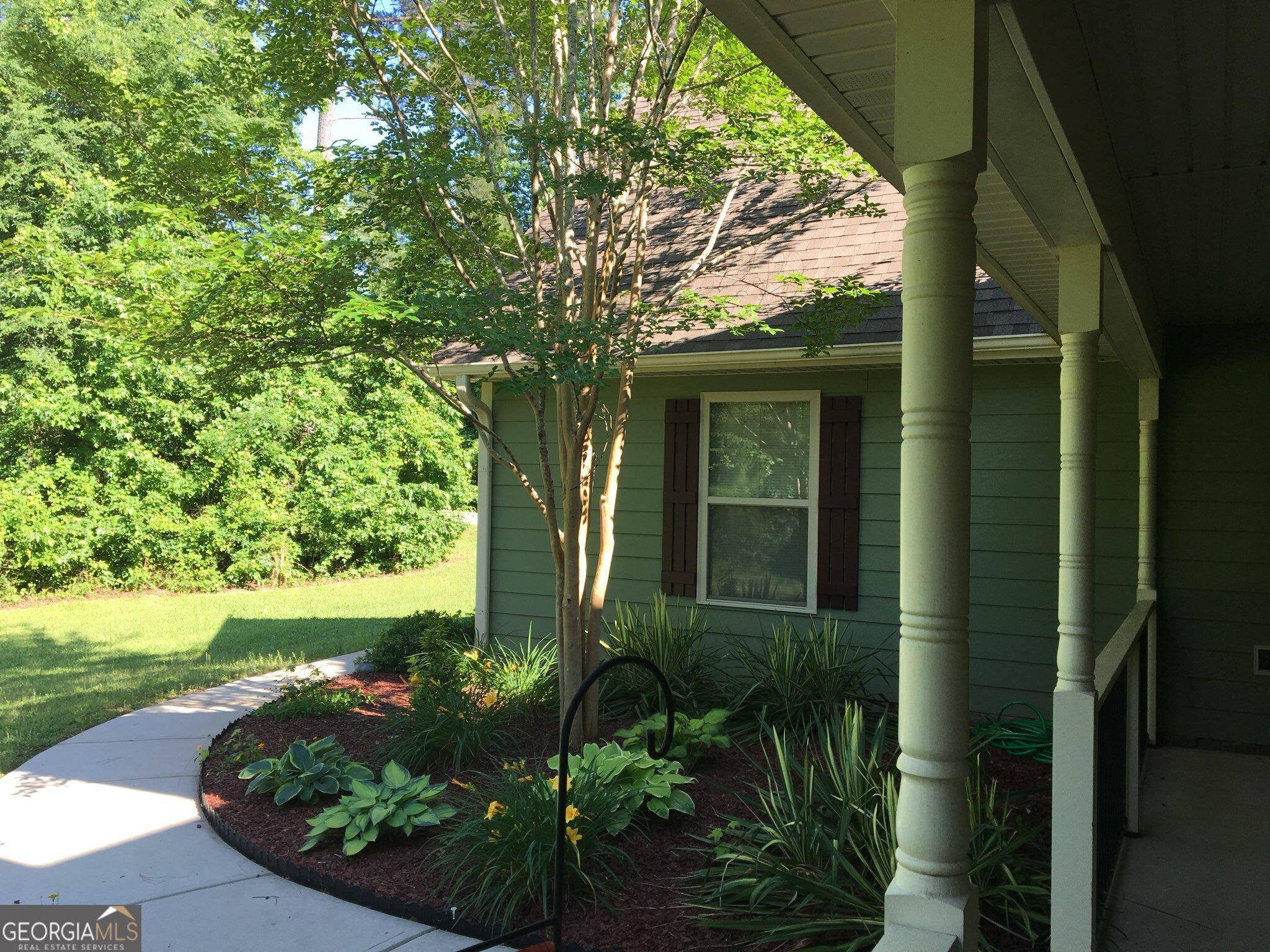 950 John Lovelace Road LaGrange, GA 30241 - Photo 7 of 47 a view of a garden in front of a house