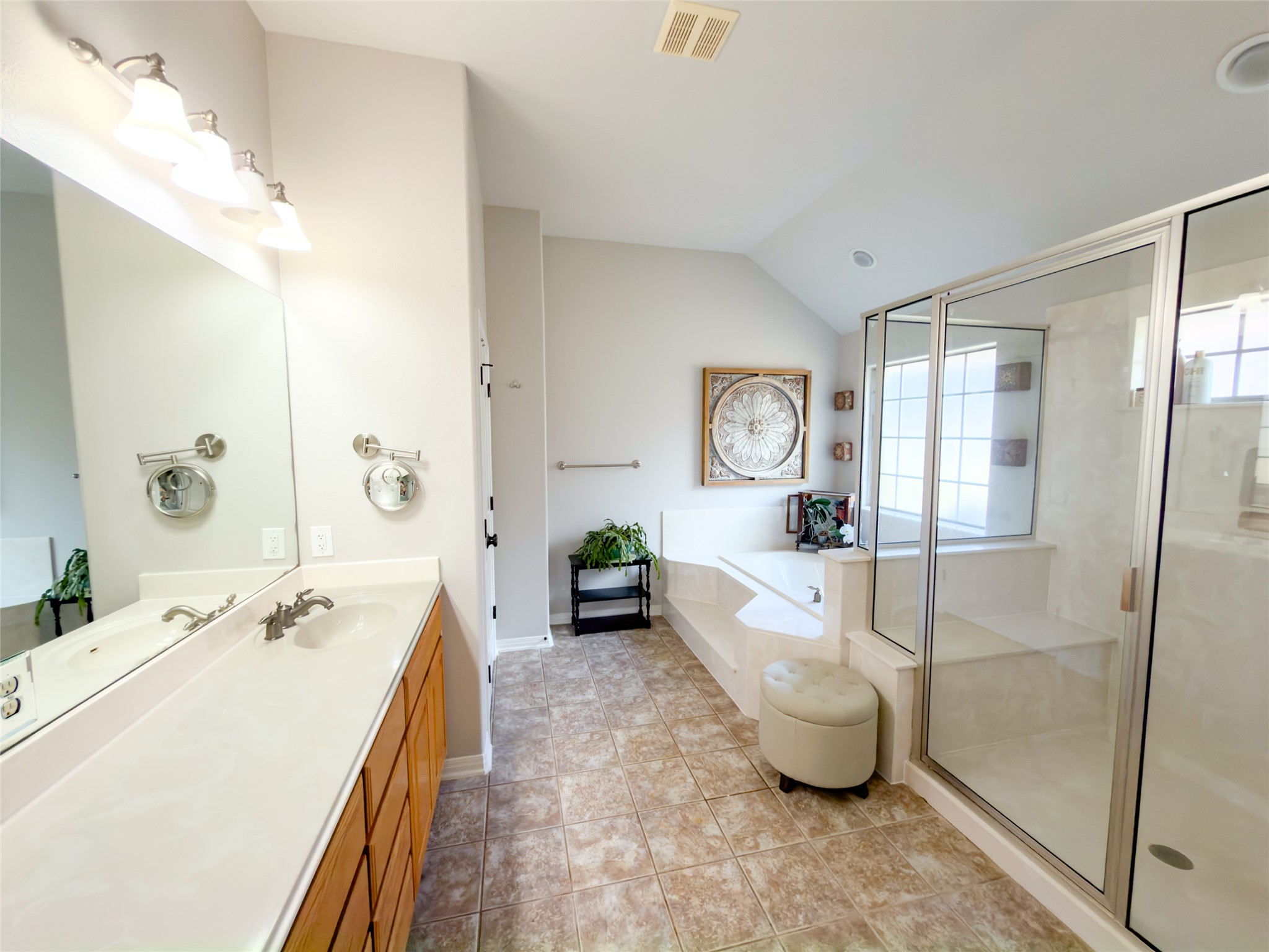 748 Nelson Ranch Road Cedar Park, TX 78613 - Photo 10 of 24 a spacious bathroom with a double vanity sink a mirror and a bathtub