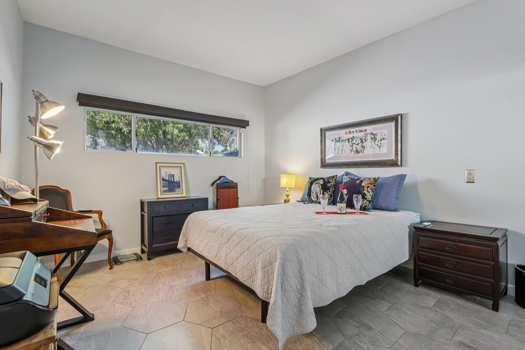 1815 West Nicola Road Palm Springs, CA 92262 - Photo 14 of 30 a bedroom with a bed and a desk