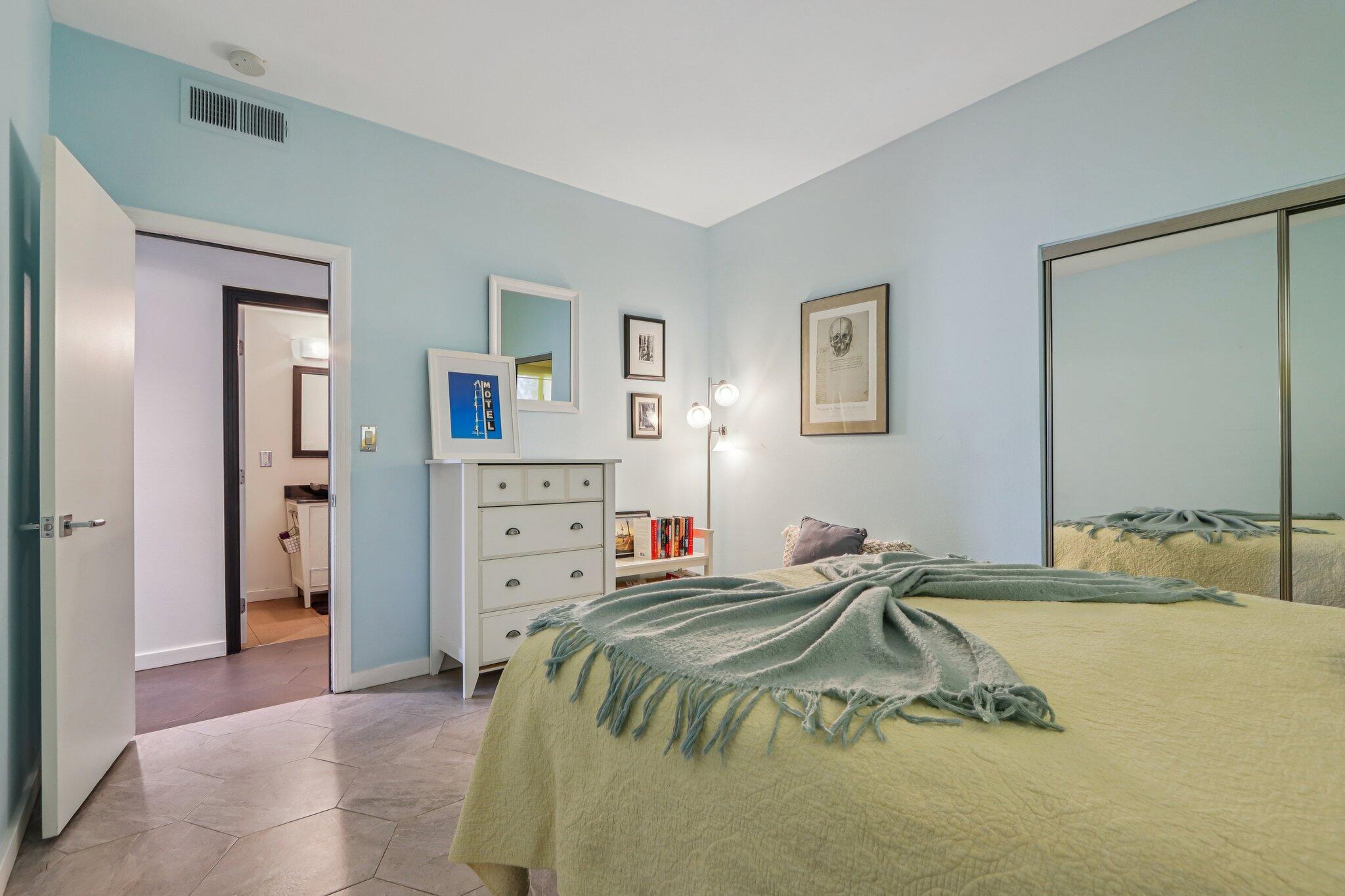 1815 West Nicola Road Palm Springs, CA 92262 - Photo 17 of 30 a bedroom with a bed and a cabinets