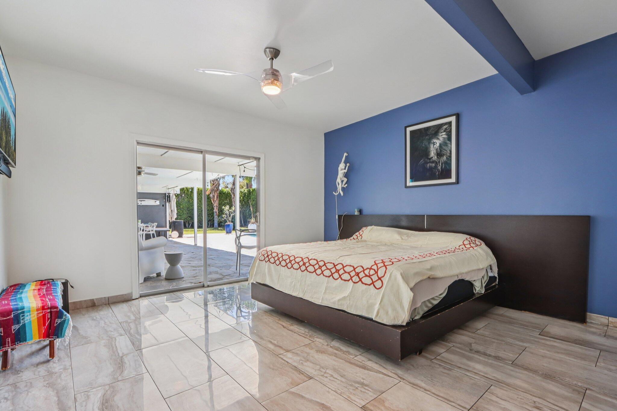 1815 West Nicola Road Palm Springs, CA 92262 - Photo 18 of 30 a bedroom with a bed and a painting on the wall