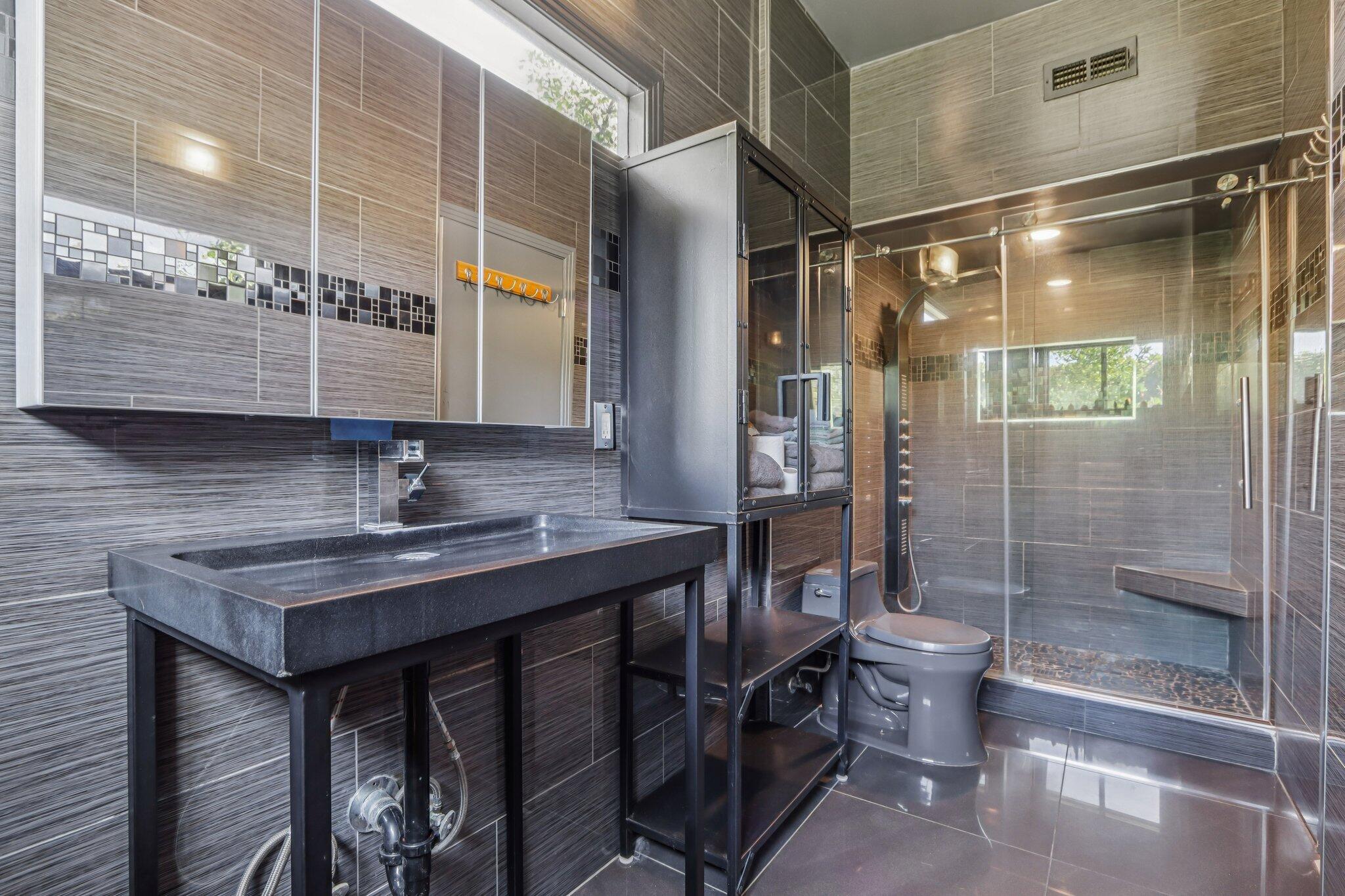 1815 West Nicola Road Palm Springs, CA 92262 - Photo 19 of 30 a bathroom with a sink a toilet and shower