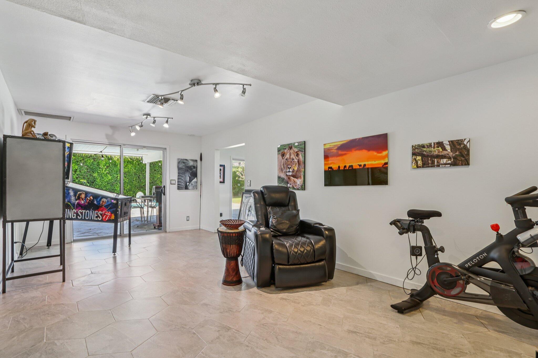 1815 West Nicola Road Palm Springs, CA 92262 - Photo 22 of 30 a living room with furniture a window and gym equipment