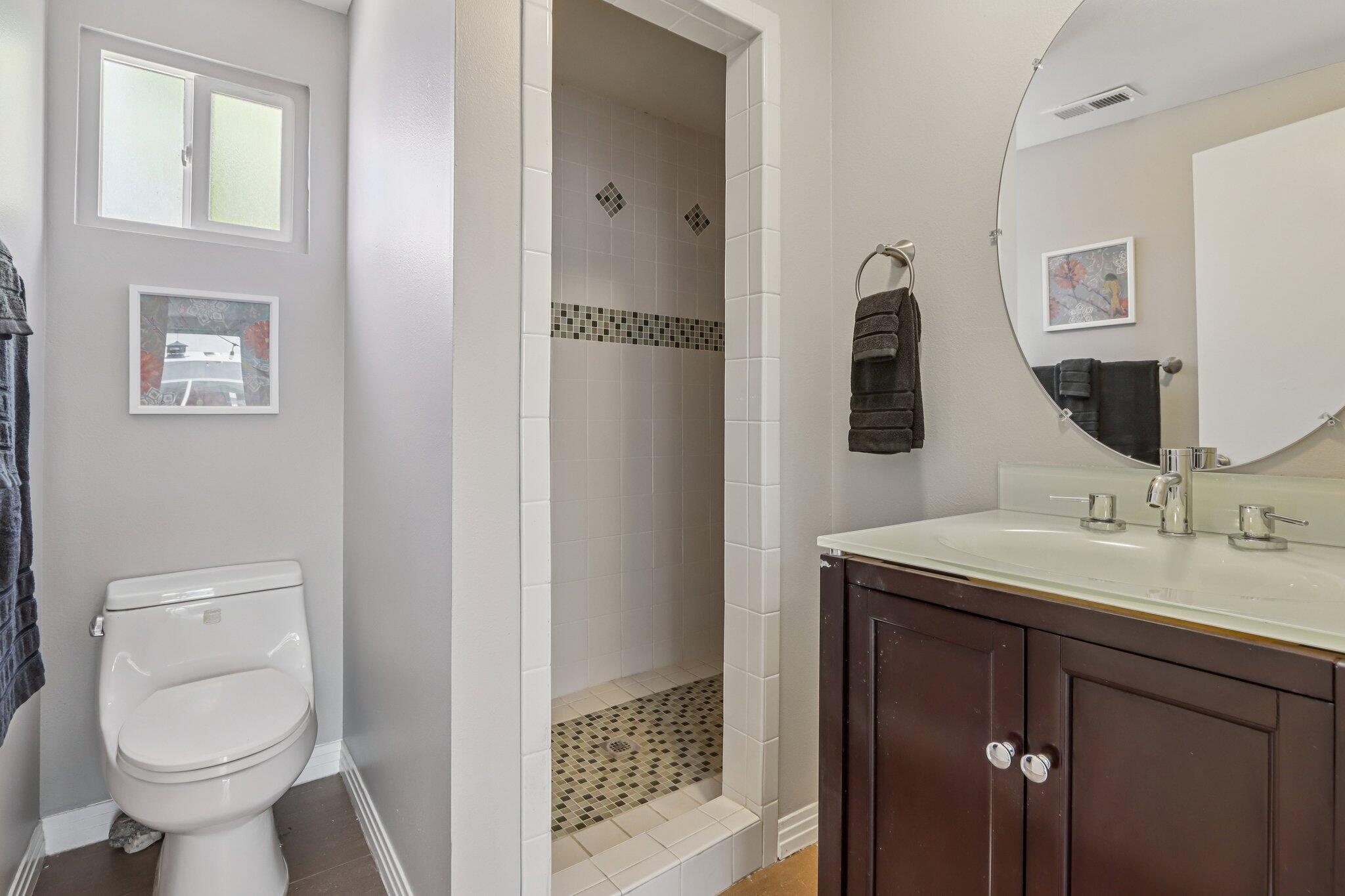 1815 West Nicola Road Palm Springs, CA 92262 - Photo 25 of 30 a bathroom with a toilet sink and mirror