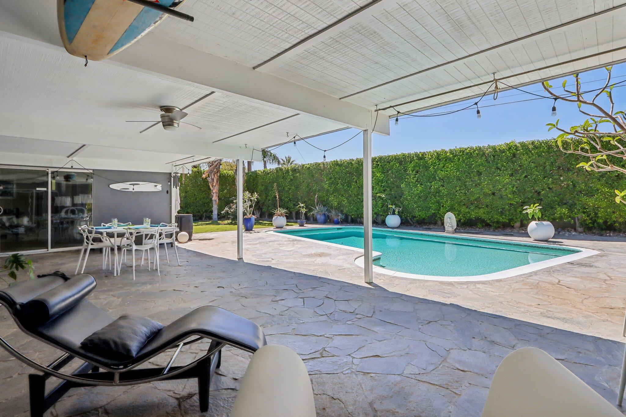 1815 West Nicola Road Palm Springs, CA 92262 - Photo 26 of 30 a view of a patio with a table and chairs