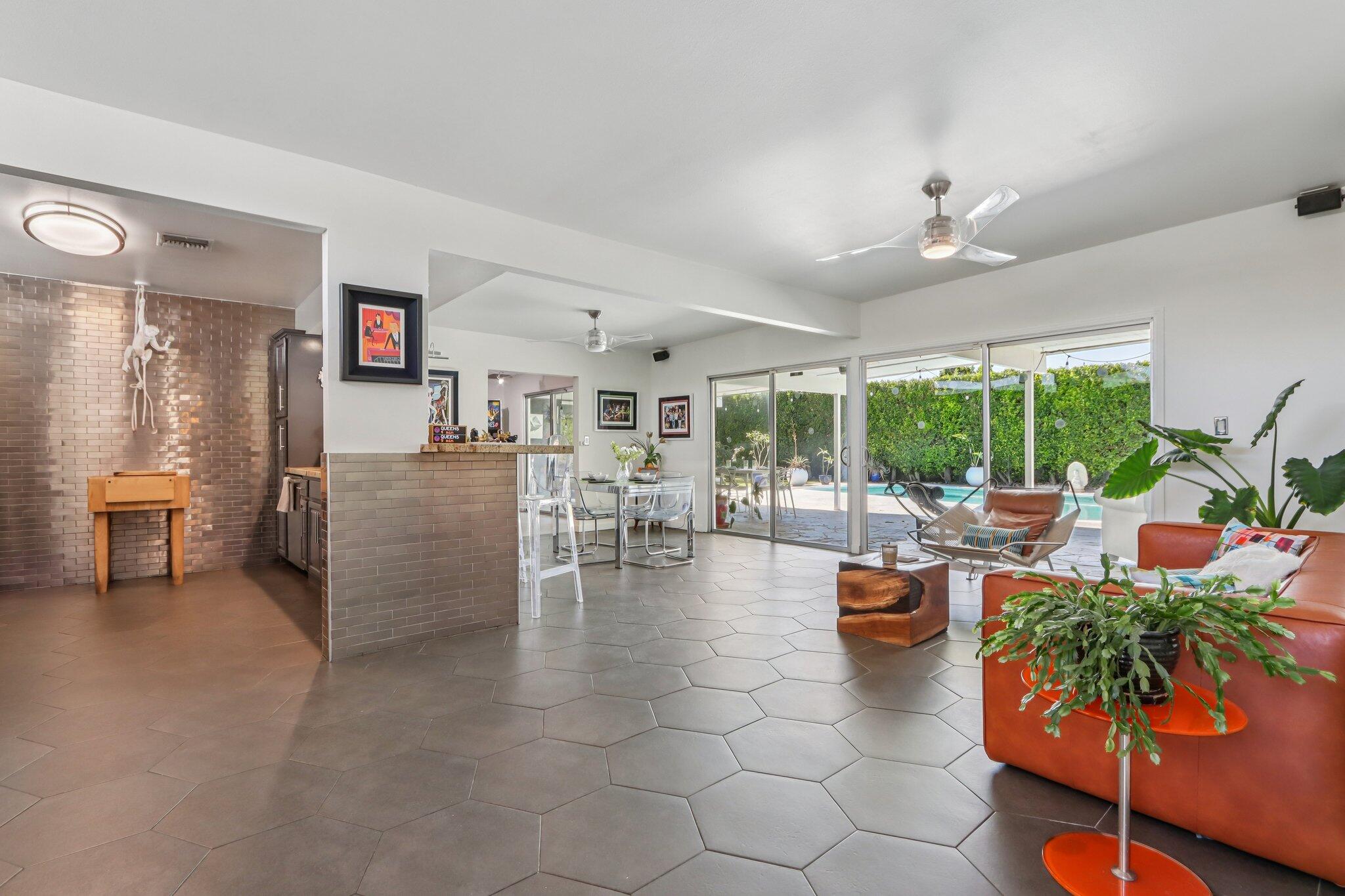 1815 West Nicola Road Palm Springs, CA 92262 - Photo 5 of 30 a living room with fireplace furniture and a large window