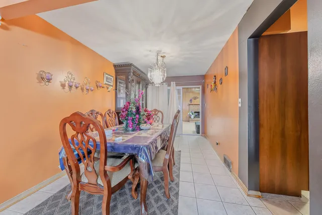 a view of a dining room with furniture and window