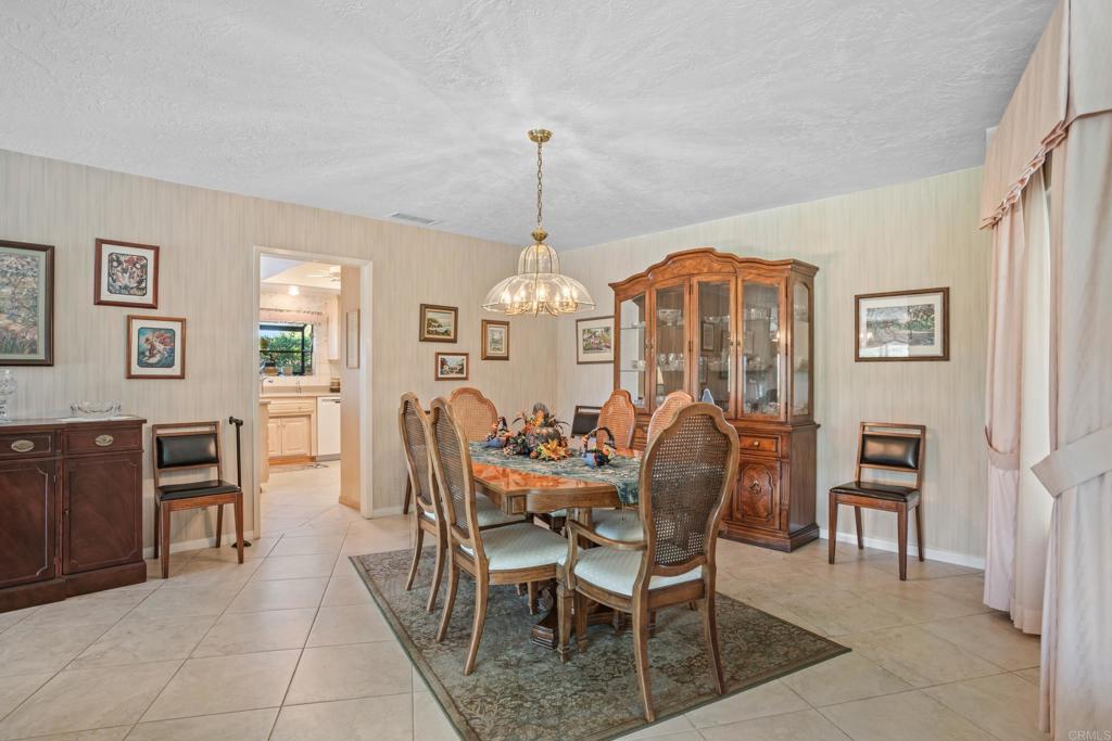 10951 Rim Road Escondido, CA 92026 - Photo 15 of 55 a view of a dining room with furniture and chandelier