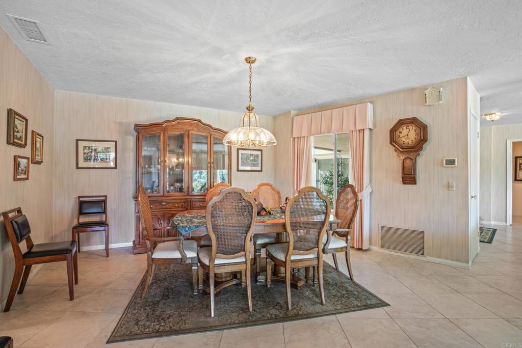 10951 Rim Road Escondido, CA 92026 - Photo 17 of 55 a dining room with furniture window and wooden floor