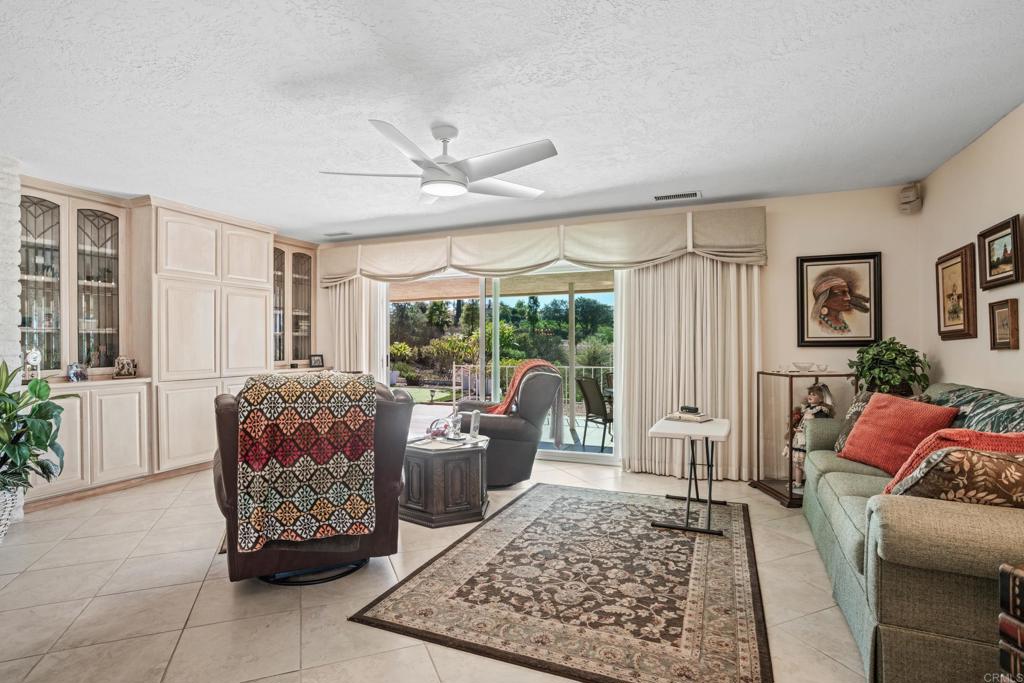 10951 Rim Road Escondido, CA 92026 - Photo 20 of 55 a living room with furniture ceiling fan and a rug