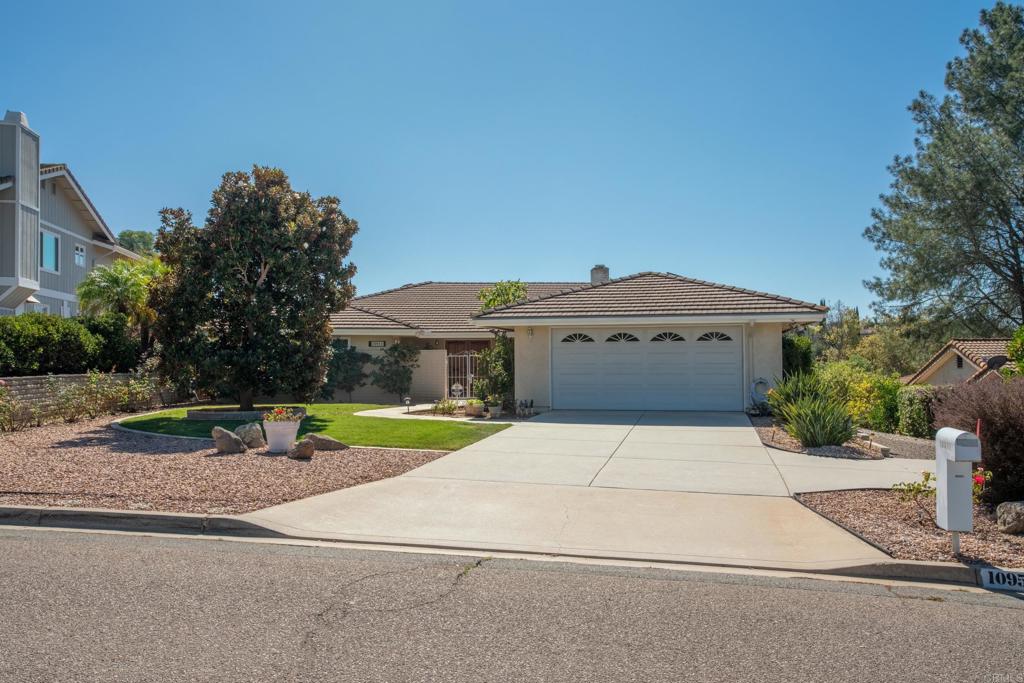 10951 Rim Road Escondido, CA 92026 - Photo 2 of 55 a front view of a house with garden
