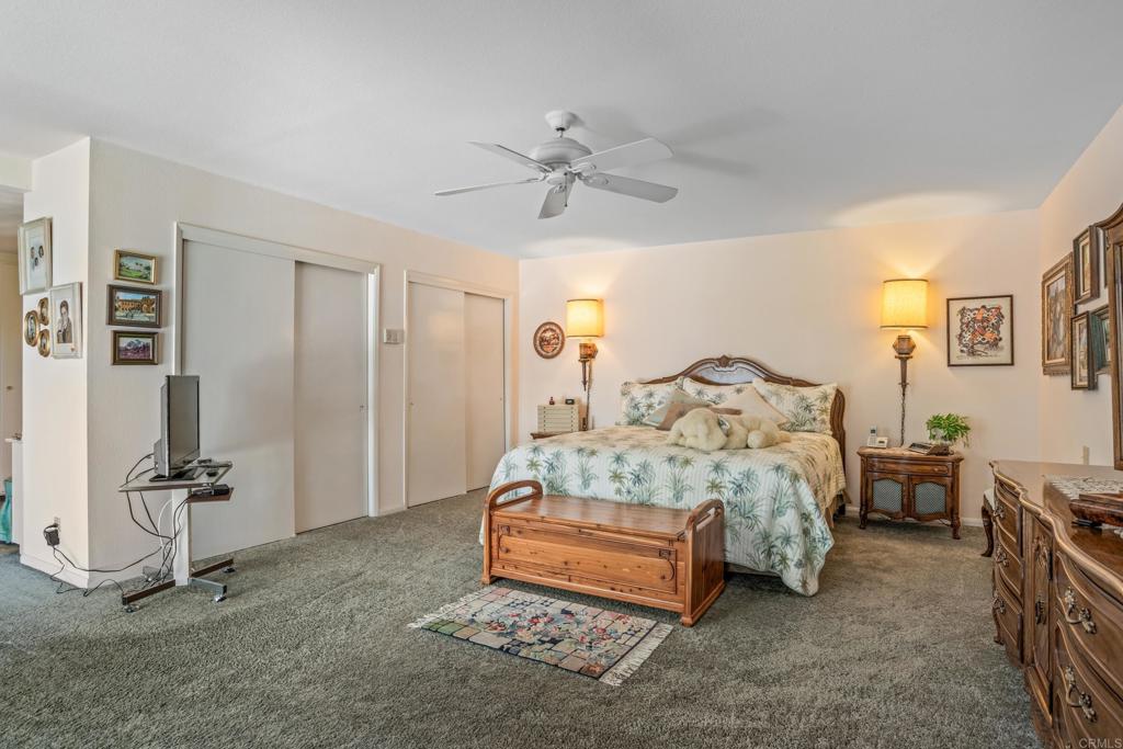 10951 Rim Road Escondido, CA 92026 - Photo 25 of 55 a bedroom with a bed and ceiling fan