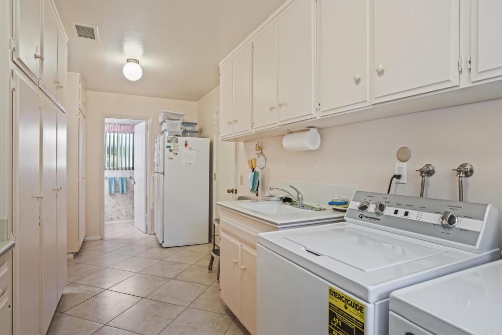 10951 Rim Road Escondido, CA 92026 - Photo 34 of 55 a utility room with dryer and washer