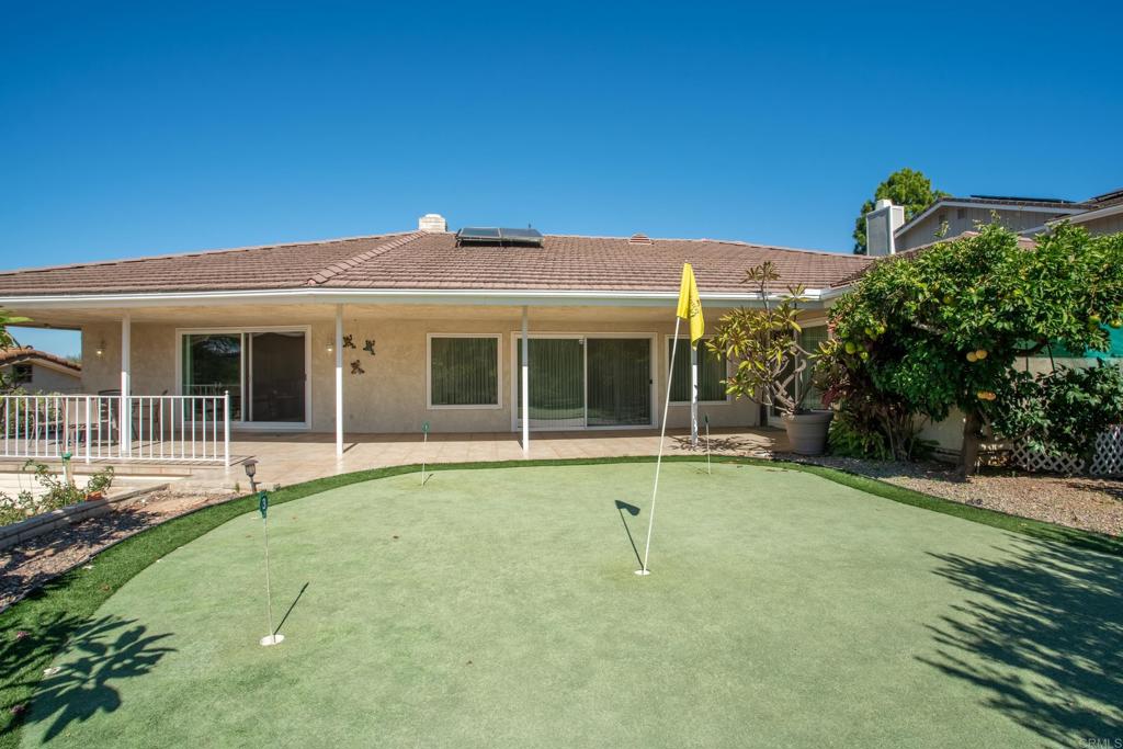 10951 Rim Road Escondido, CA 92026 - Photo 7 of 55 a front view of a house with a yard