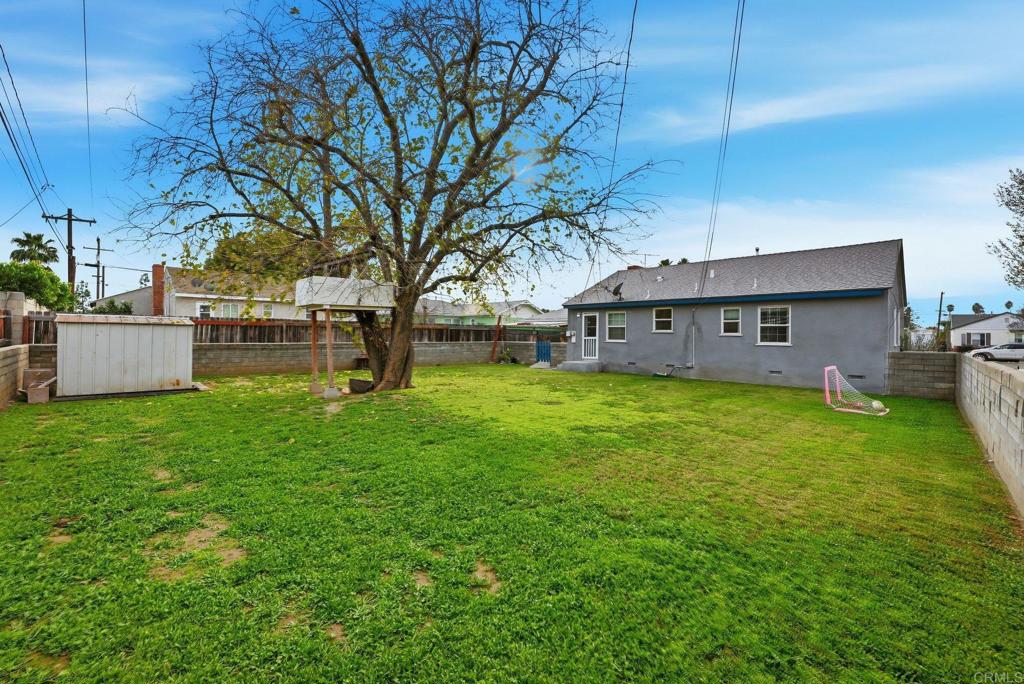 6974 Capistrano Way Riverside, CA 92504 - Photo 17 of 24 a view of a house with a yard