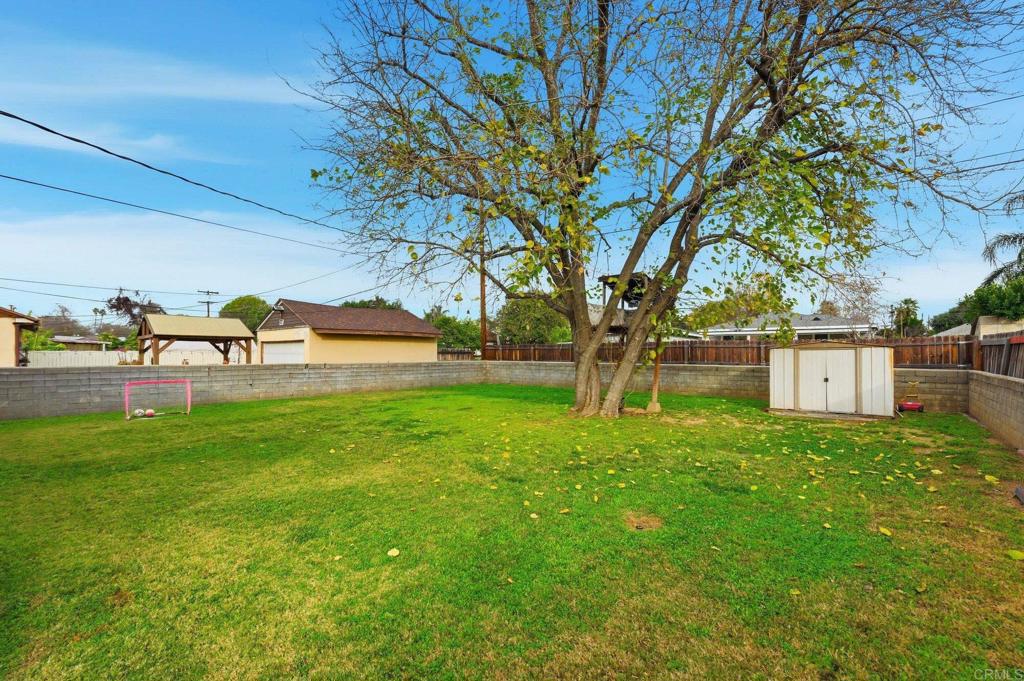 6974 Capistrano Way Riverside, CA 92504 - Photo 18 of 24 a view of a park with large trees