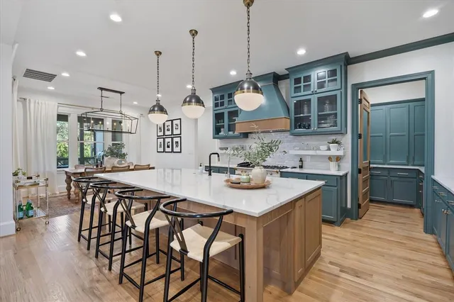 a kitchen with a counter space cabinets and appliances