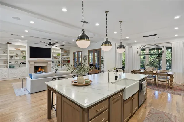 a dining room with furniture a chandelier and window