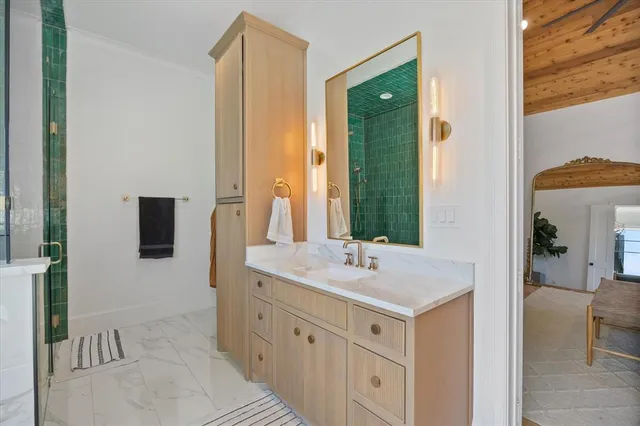 a bathroom with a sink and a mirror