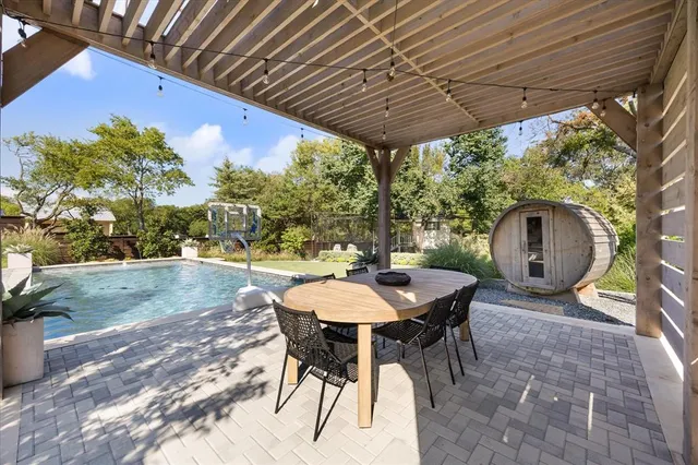 a view of a swimming pool with a lounge chairs