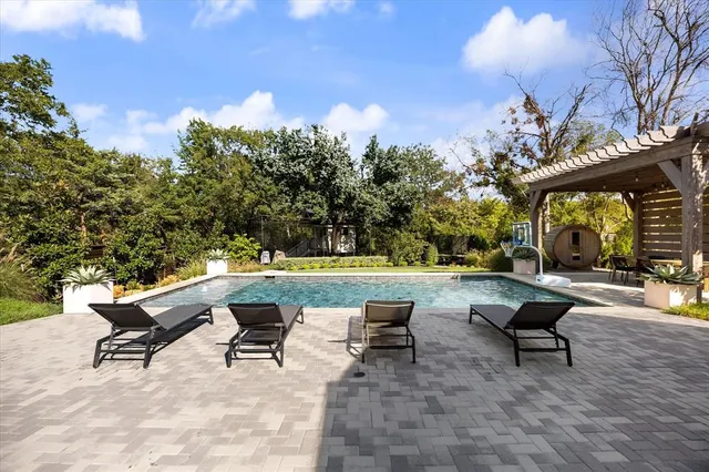 a view of a swimming pool with a lounge chairs