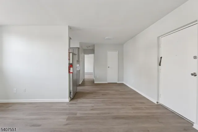 a view of a livingroom with wooden floor