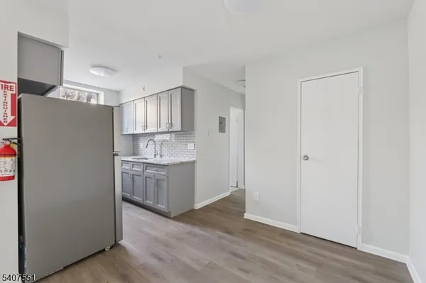 a kitchen with granite countertop cabinets and a stove