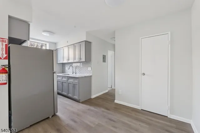 a kitchen with granite countertop cabinets and a stove
