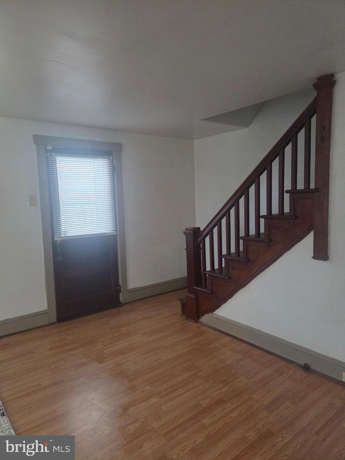 3259 Main Street Conestoga, PA 17516 - Photo 5 of 11 a view of an empty room with wooden floor and windows