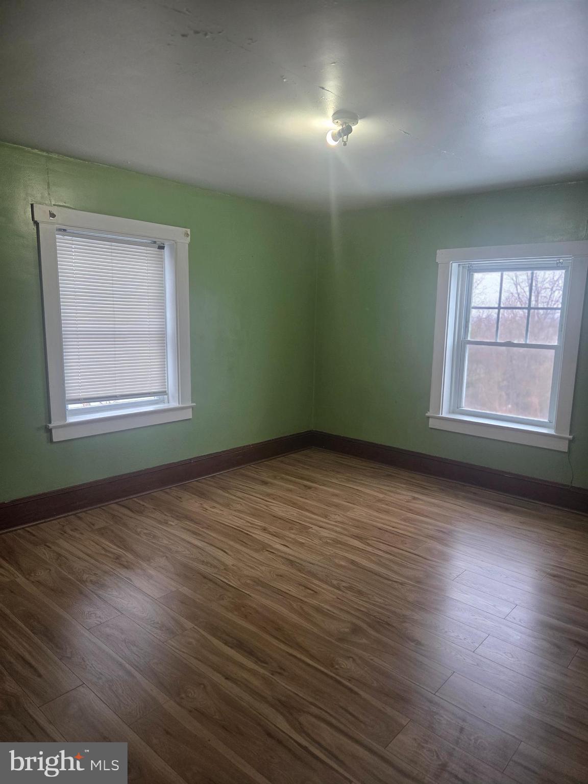 3259 Main Street Conestoga, PA 17516 - Photo 10 of 11 an empty room with wooden floor and windows