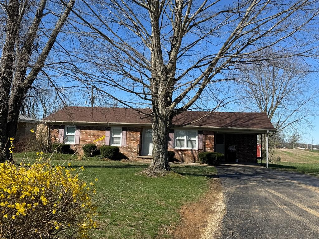 65 Old Quarry Road Elkton, KY 42220 - Photo 2 of 2 a front view of a house with garden