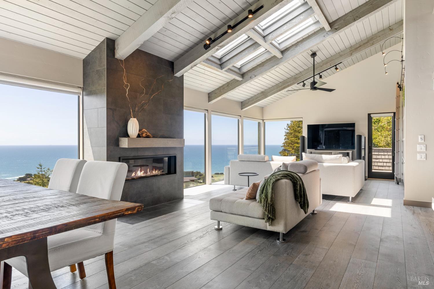 Undisclosed Address The Sea Ranch, CA 95497 - Photo 1 of 46 a living room with furniture and a fireplace