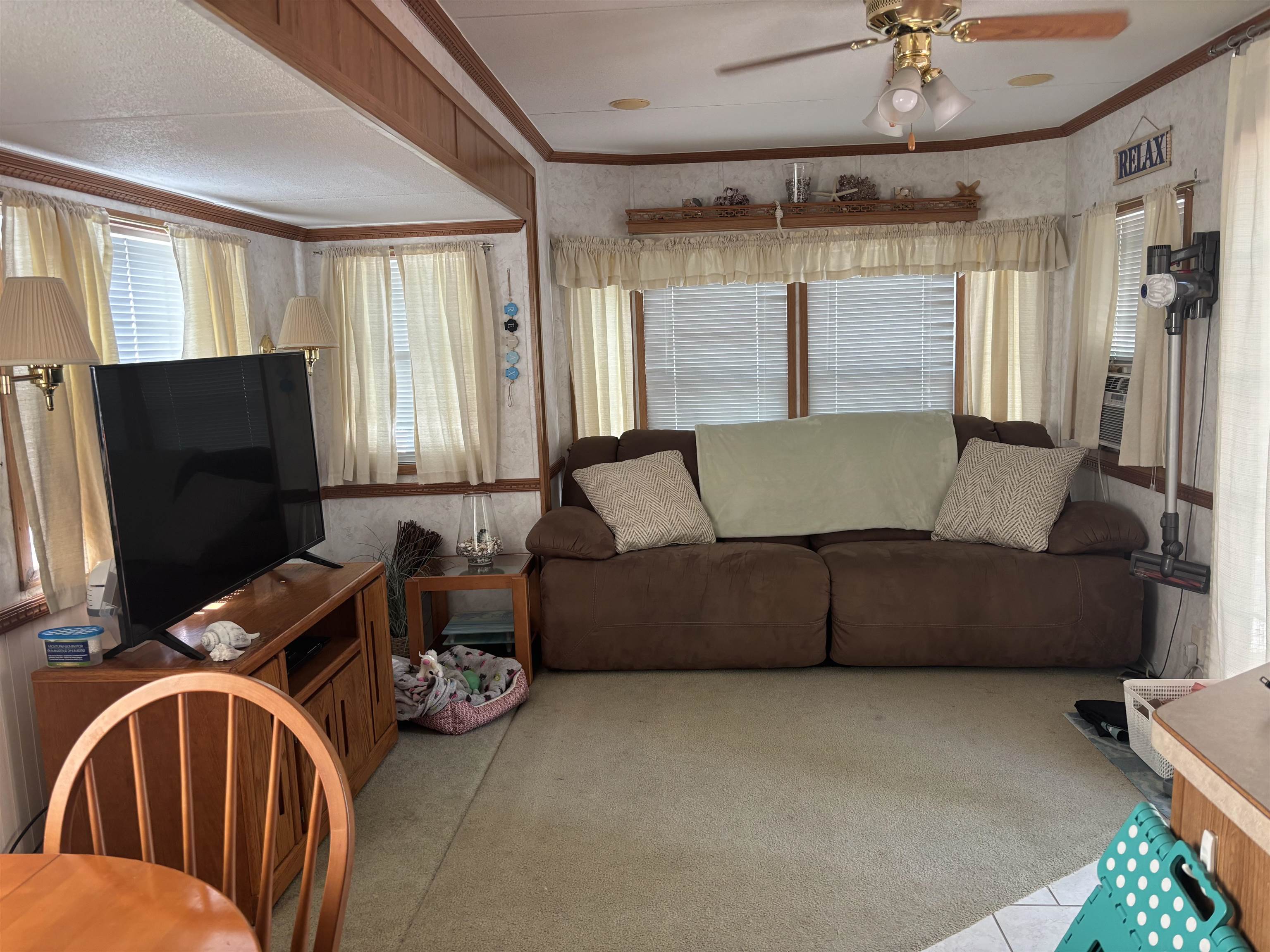 60 Corsons Tavern Road Ocean View, NJ 08230 - Photo 11 of 17 a living room with furniture and a flat screen tv