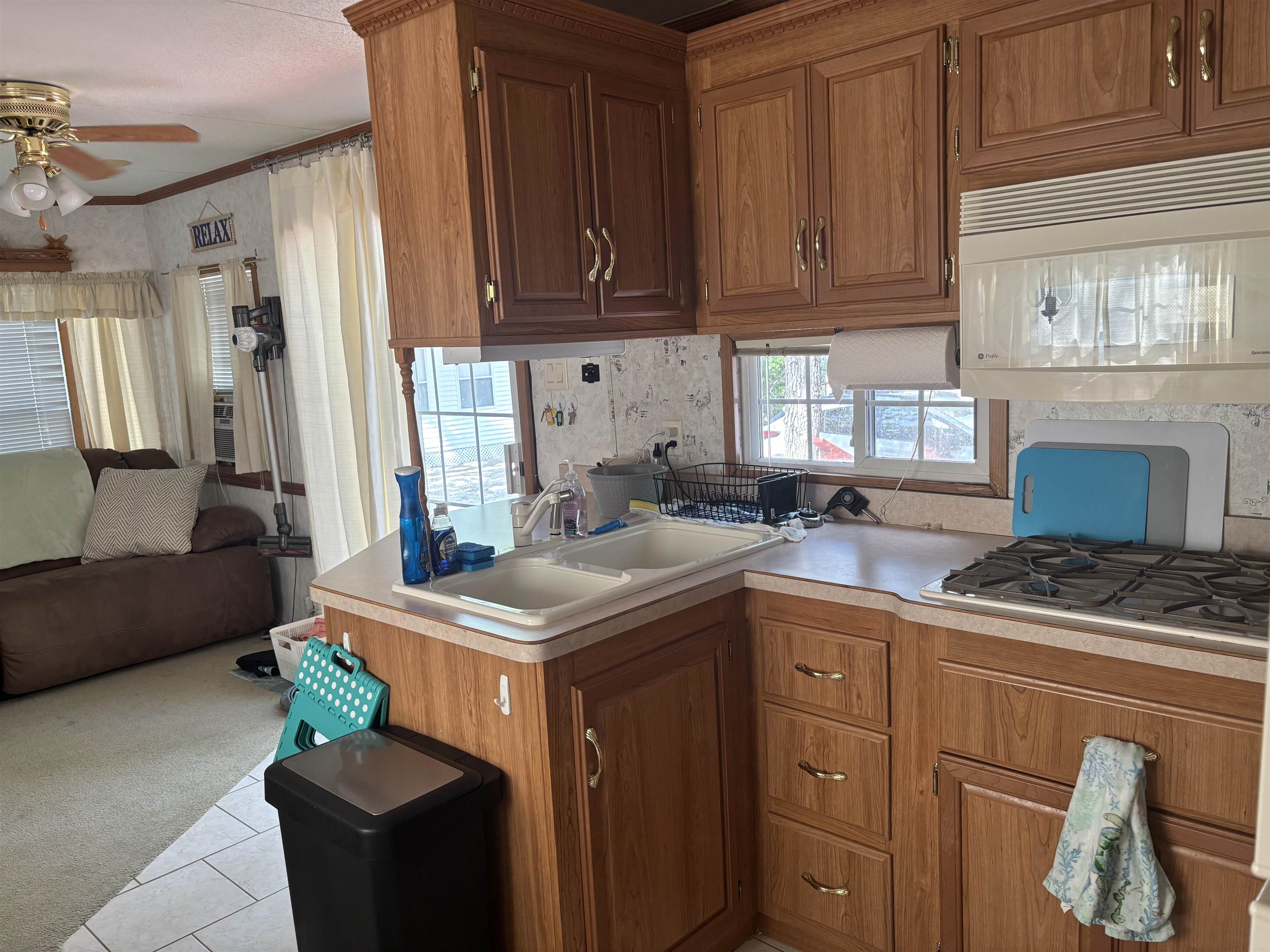 60 Corsons Tavern Road Ocean View, NJ 08230 - Photo 14 of 17 a kitchen with a stove and a refrigerator