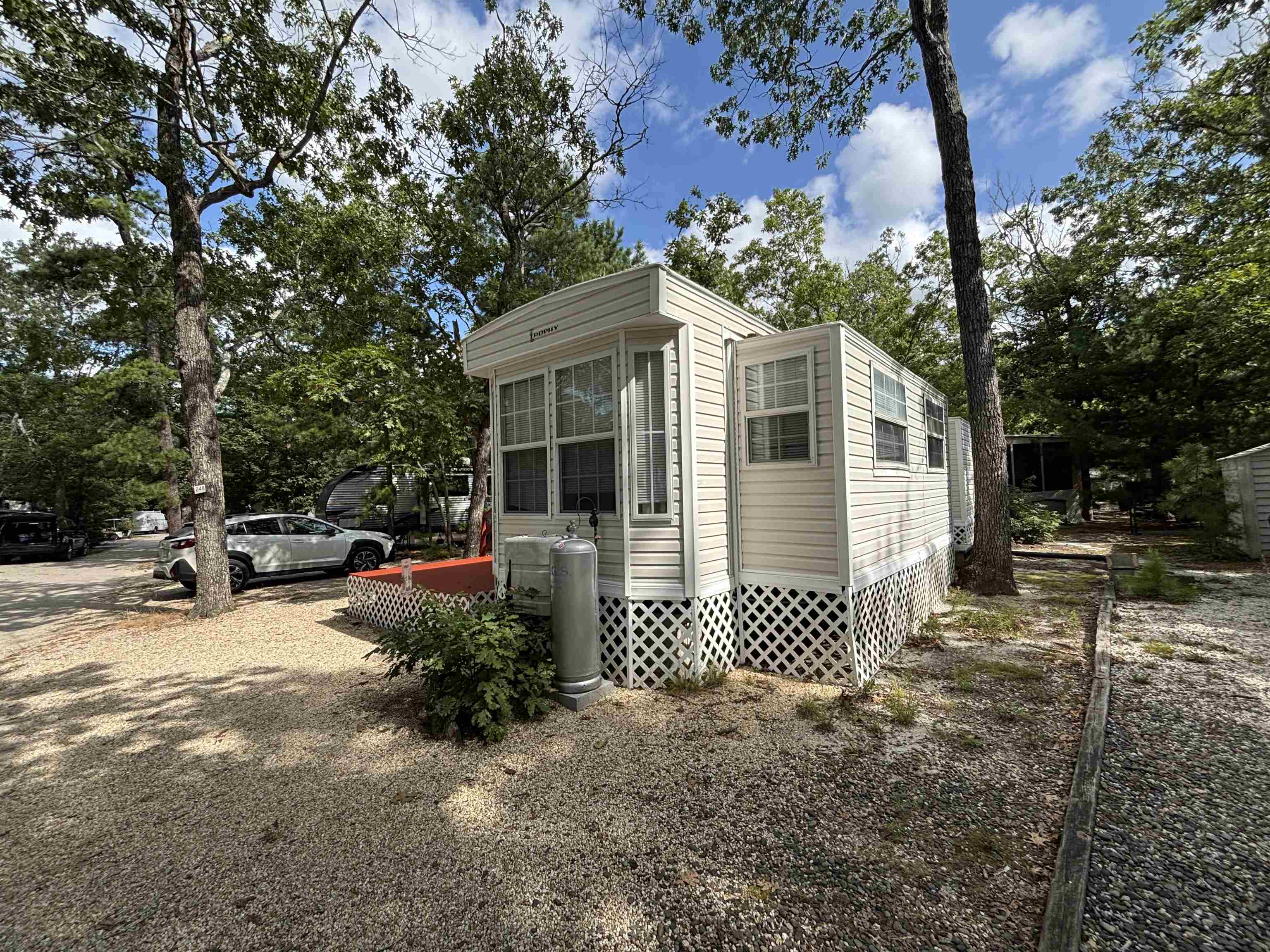 60 Corsons Tavern Road Ocean View, NJ 08230 - Photo 4 of 17 a front view of a house with a garden