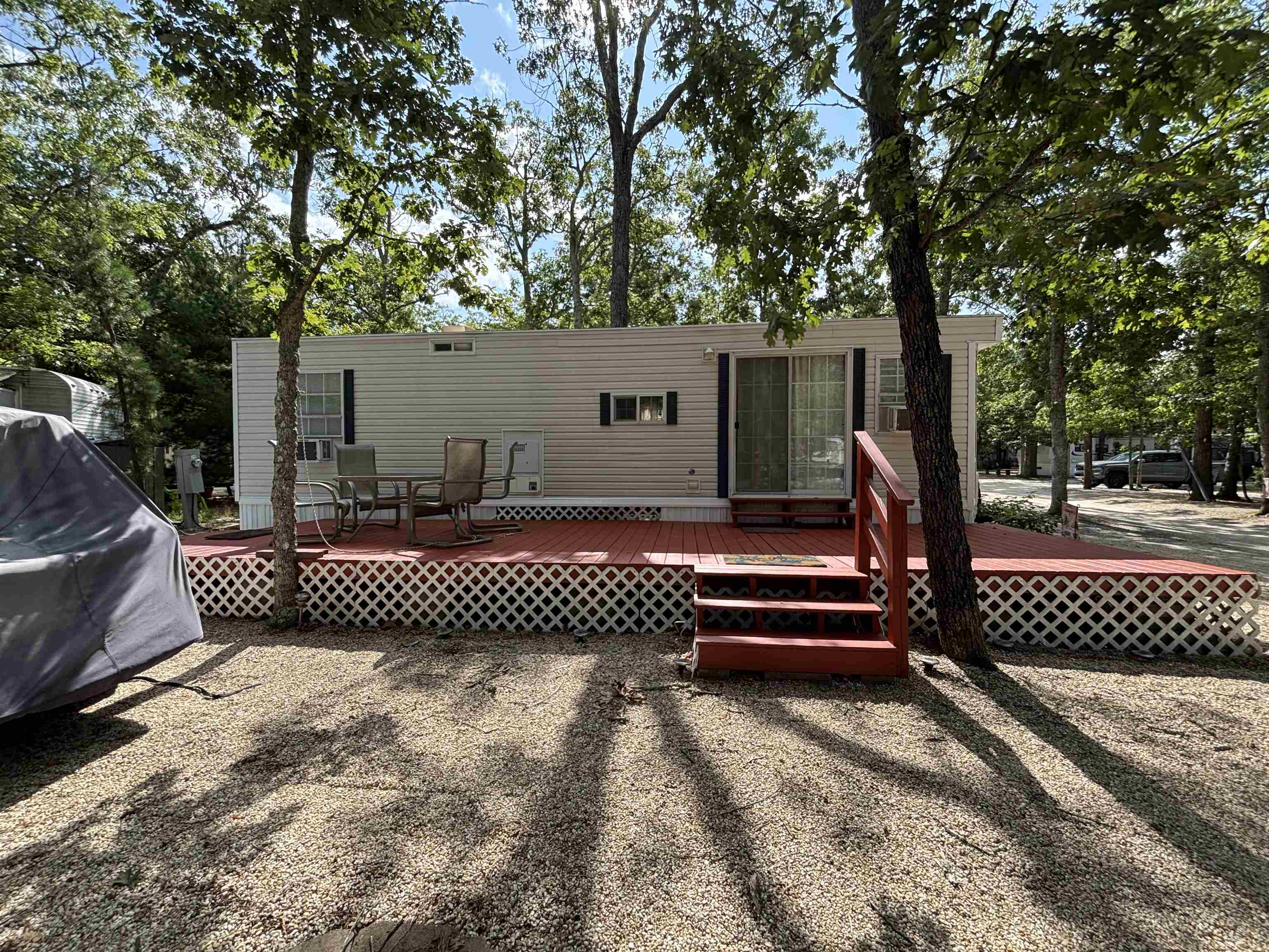 60 Corsons Tavern Road Ocean View, NJ 08230 - Photo 5 of 17 a front view of a house with a garden