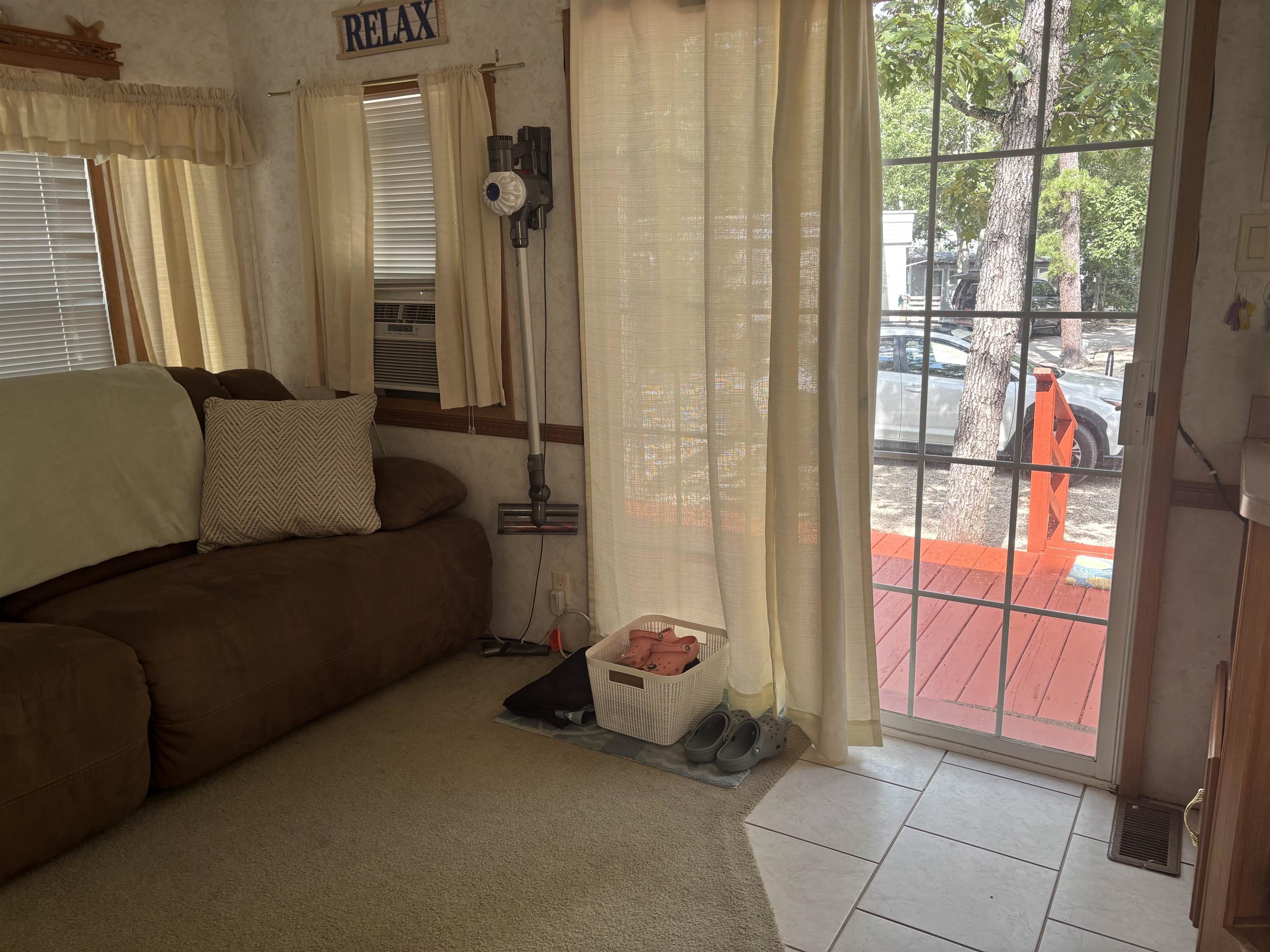 60 Corsons Tavern Road Ocean View, NJ 08230 - Photo 10 of 17 a living room with furniture and a floor to ceiling window
