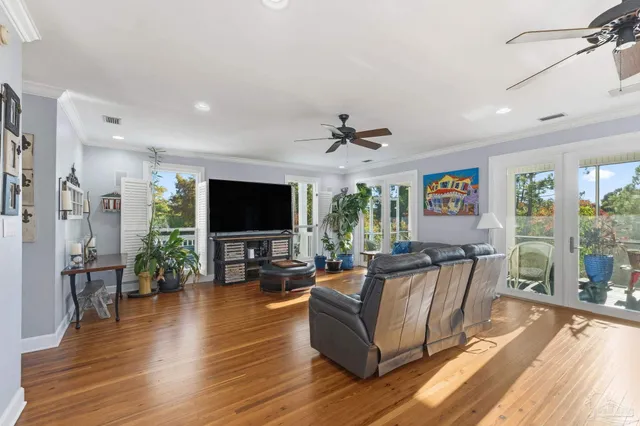 a kitchen with granite countertop a sink a counter top space stainless steel appliances and cabinets