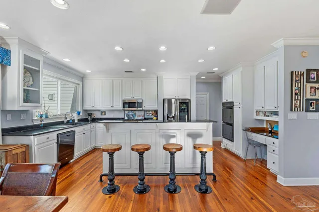 a view of balcony with couch and wooden floor