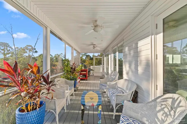 a bathroom with a granite countertop sink a mirror and a shower