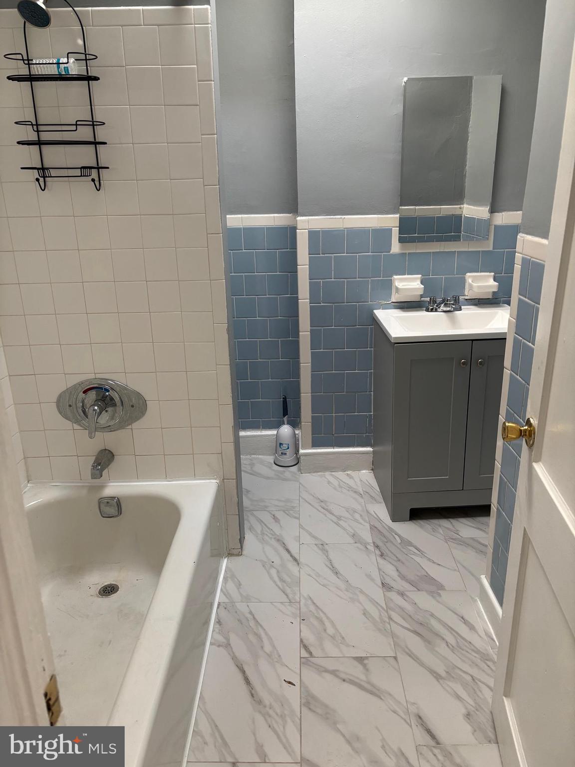 2456 Keyworth Avenue, Unit 2 Baltimore, MD 21215 - Photo 8 of 9 a bathroom with a sink and a tub