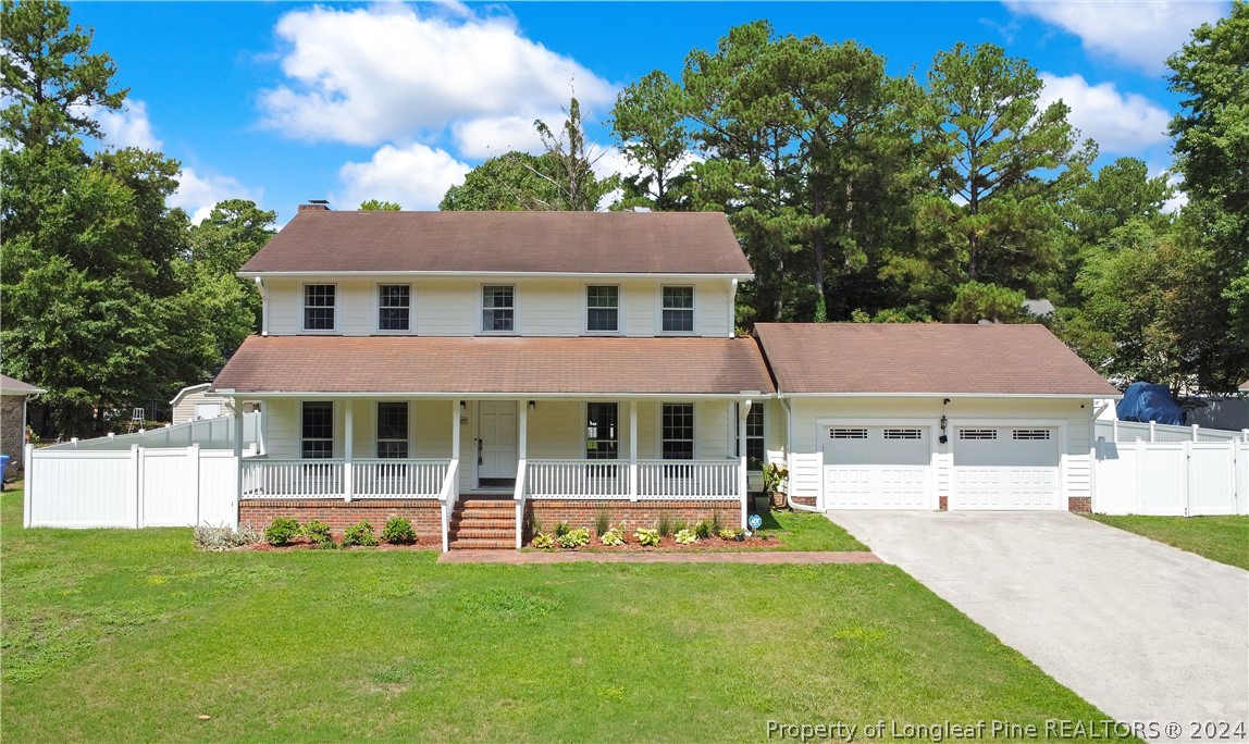 5809 Waldwick Road Fayetteville, NC 28311 - Photo 1 of 33 a view of a house with a yard patio and swimming pool
