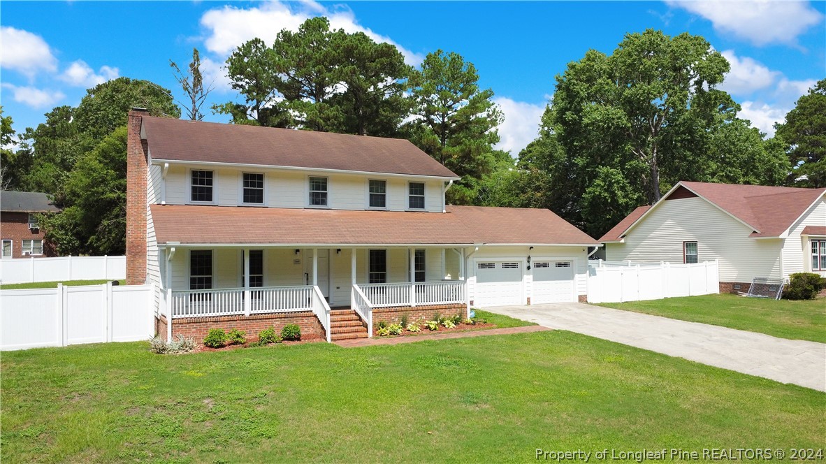 5809 Waldwick Road Fayetteville, NC 28311 - Photo 2 of 33 a front view of a house with a yard table and chairs