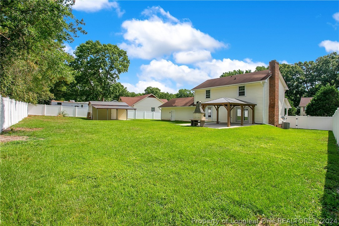 5809 Waldwick Road Fayetteville, NC 28311 - Photo 25 of 33 a view of a house with a big yard