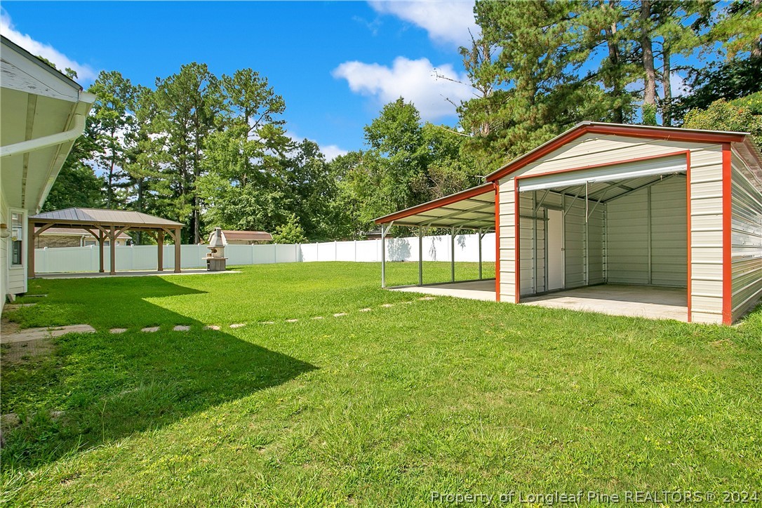 5809 Waldwick Road Fayetteville, NC 28311 - Photo 28 of 33 a view of an house with backyard space and garden