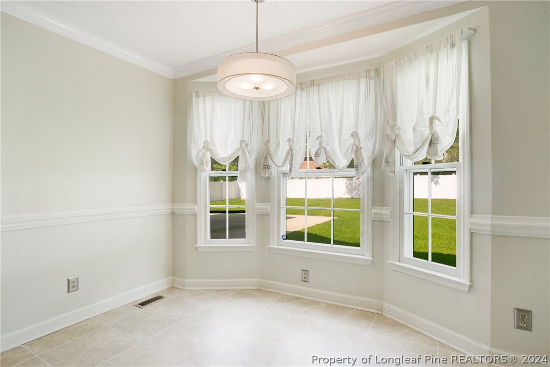 5809 Waldwick Road Fayetteville, NC 28311 - Photo 10 of 33 an empty room with windows and entrance